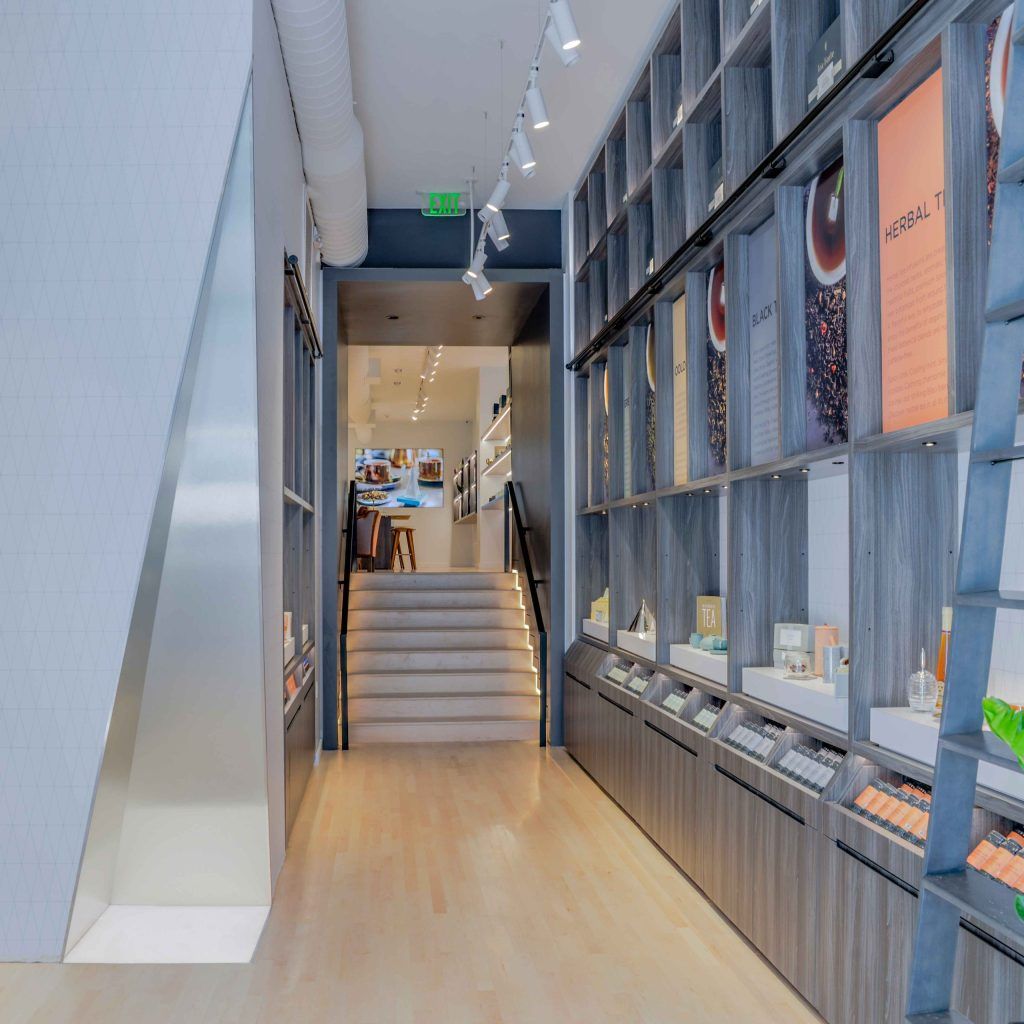 Tea selections along open shelving.